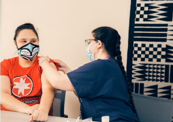 nurse-administers-covid-19-vaccine-to-a-patient-wearing-mask